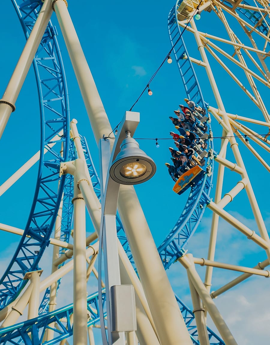 Illuminated roller coaster at night