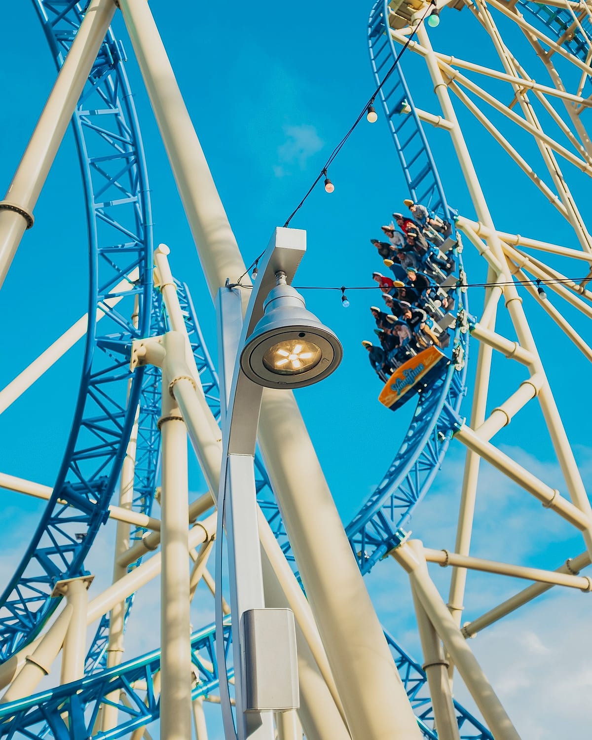 Riders inverted on a steel roller coaster loop